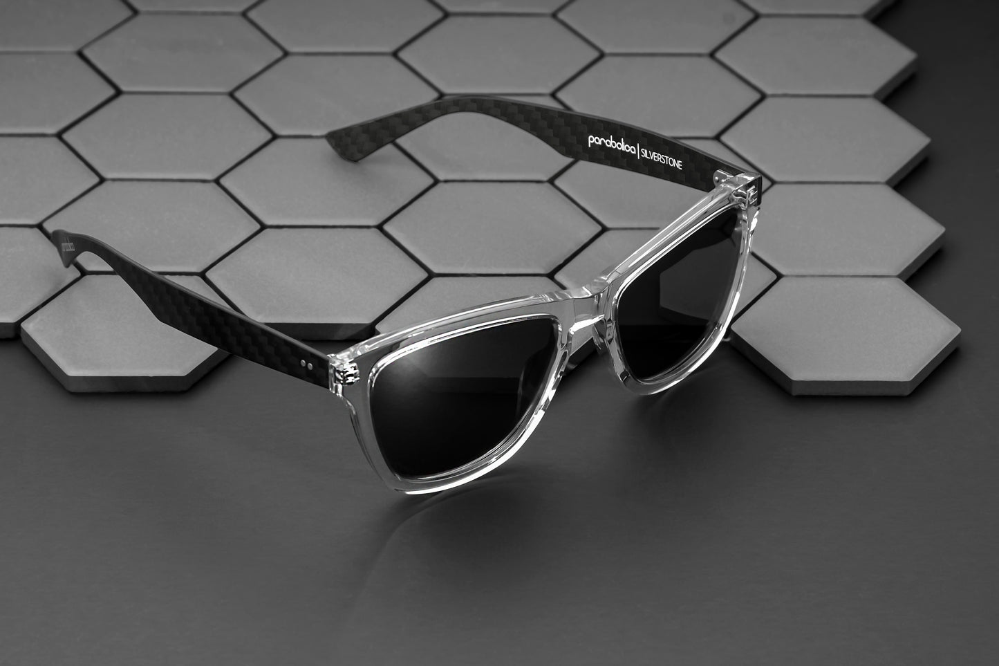 Parabolica Silverstone carbon fiber sunglasses, clear with mirrored polarized lenses, studio.